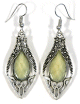Boucles d'oreilles pendantes en metal argente cisele serties de pierres jaune