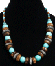 Collier ethnique artisanal imitation disques marrons et boules bleues marine agrementees de perles bleues et en bois