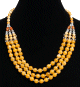 Collier ethnique artisanal imitation perles jaunes trois rangs agrementees de petites perles en metal et en bois