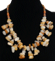 Collier ethnique artisanal imitation pierres marbrees multicolores agrementees de perles multicolores
