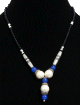 Collier ethnique artisanal imitation trois boules blanches agencees de perles multicolores et de deux tubes argentes